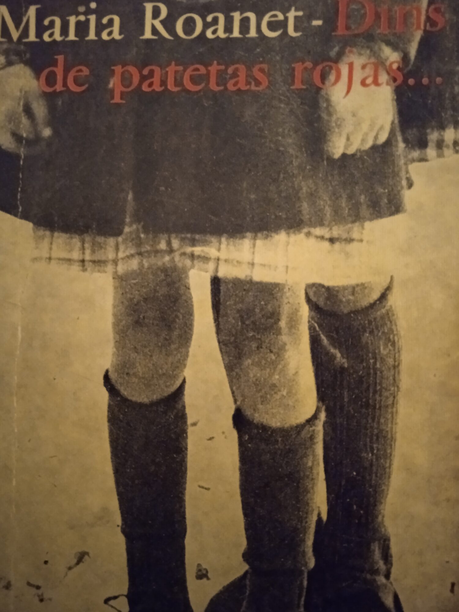 a group of people standing on top of a beach under a cloudy blue sky