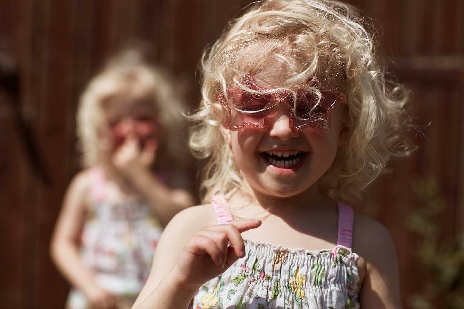 A little girl with a pair of glasses on her face