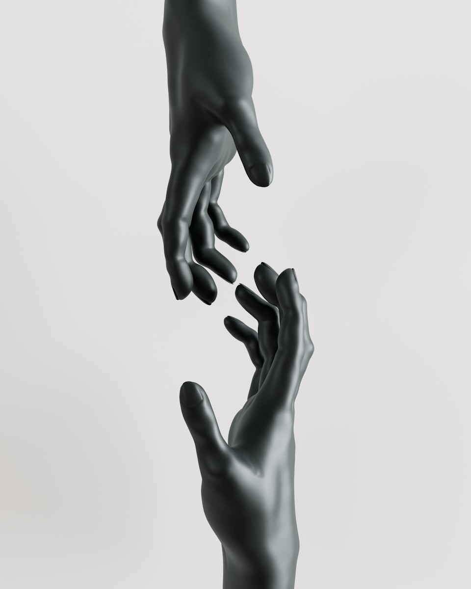 A couple of hands reaching for each other